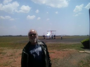 KDM's Glenn Roseberry, boarding a small aircraft for inter-Kenya travel